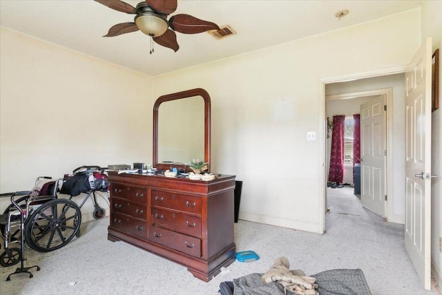 interior space with ceiling fan