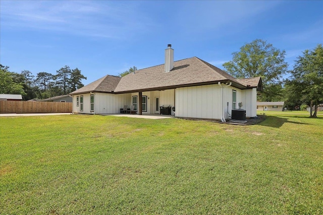 560 Lyndale St, Vidor, TX 77662 - rear view of property with a patio area, a chimney, and a shingled roof