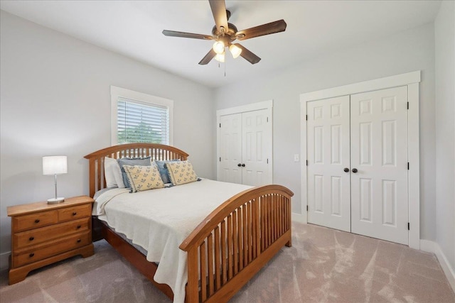 560 Lyndale St, Vidor, TX 77662 - bedroom featuring multiple closets, carpet floors, baseboards, and a ceiling fan