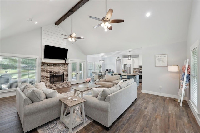 560 Lyndale St, Vidor, TX 77662 - living room with high vaulted ceiling, ceiling fan, dark wood-style floors, beamed ceiling, and a brick fireplace