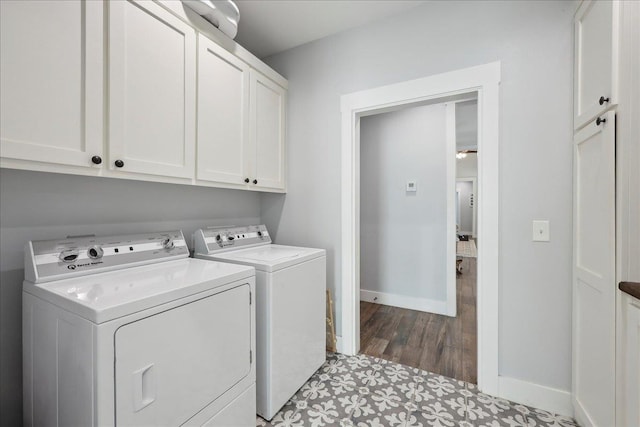 560 Lyndale St, Vidor, TX 77662 - washroom featuring cabinet space, washer and dryer, baseboards, and dark wood-style floors
