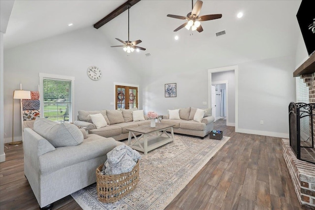 560 Lyndale St, Vidor, TX 77662 - living room featuring a fireplace, ceiling fan, high vaulted ceiling, beamed ceiling, and baseboards