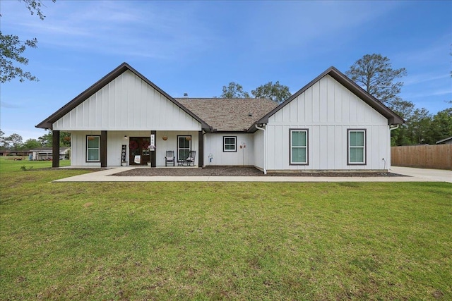 560 Lyndale St, Vidor, TX 77662 - back of house featuring board and batten siding and a shingled roof