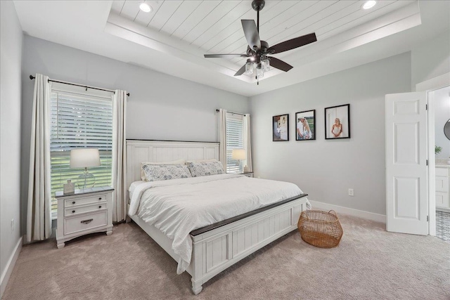 560 Lyndale St, Vidor, TX 77662 - bedroom featuring light colored carpet, a tray ceiling, wood ceiling, baseboards, and recessed lighting