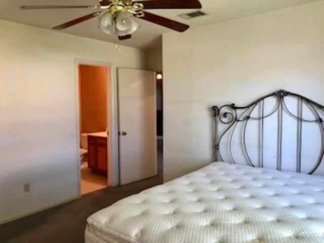 bedroom featuring connected bathroom and ceiling fan