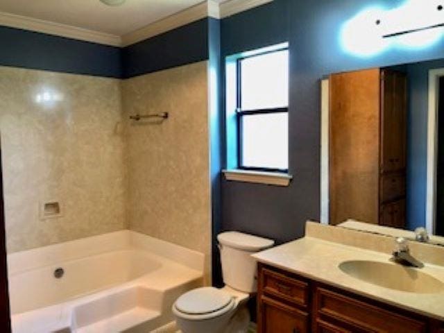 full bathroom featuring bathing tub / shower combination, toilet, vanity, and ornamental molding