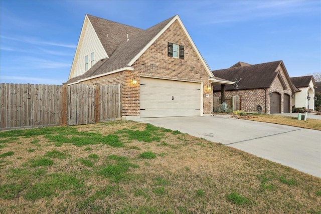 view of front of home with a garage and a front yard