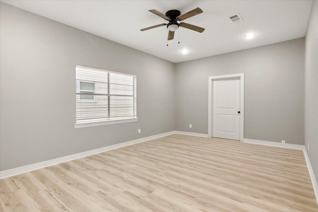 spare room featuring light hardwood / wood-style flooring and ceiling fan