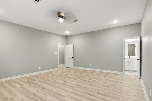 empty room with light hardwood / wood-style floors and ceiling fan