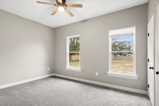 unfurnished room featuring ceiling fan and light colored carpet