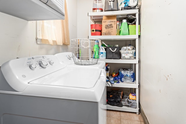 970 Evergreen Ln, Beaumont, TX 77706 - laundry area with cabinet space, washing machine and clothes dryer, tile patterned flooring, and baseboards