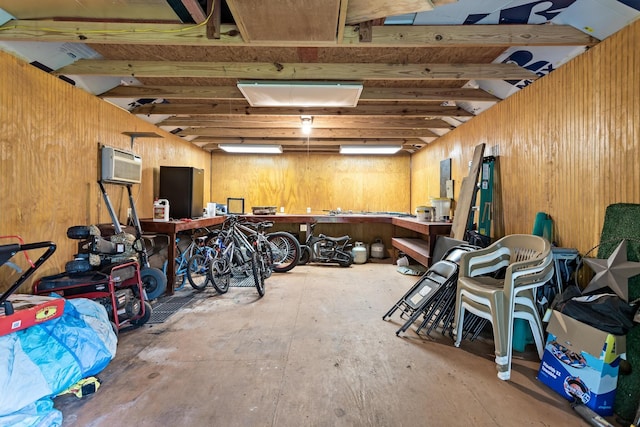 970 Evergreen Ln, Beaumont, TX 77706 - below grade area with a wall unit AC, wood walls, and a workshop area