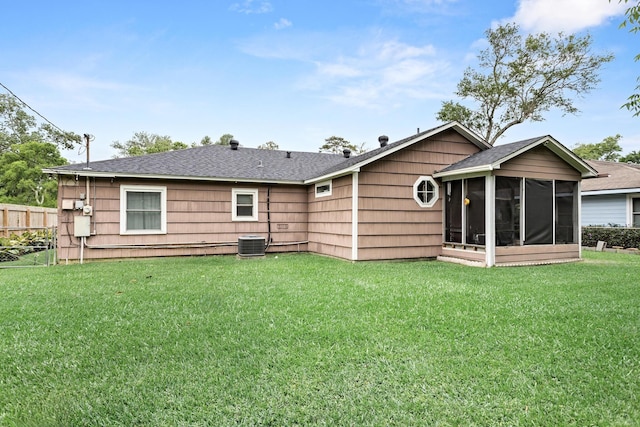970 Evergreen Ln, Beaumont, TX 77706 - back of house featuring a sunroom, central AC unit, and a shingled roof