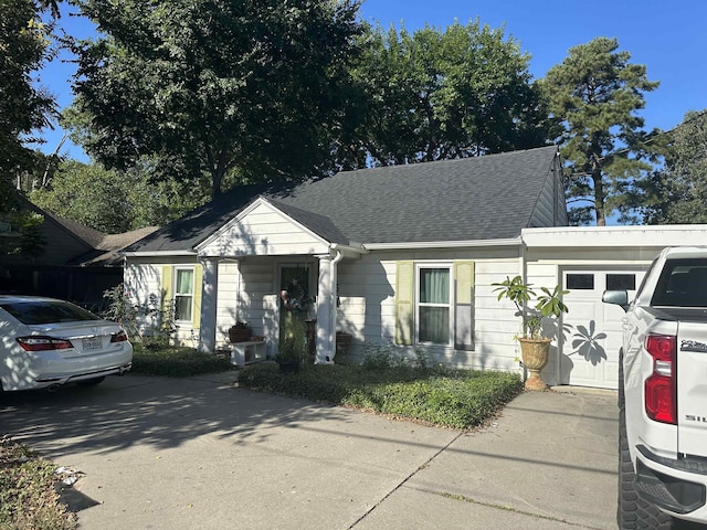 bungalow-style home featuring a garage