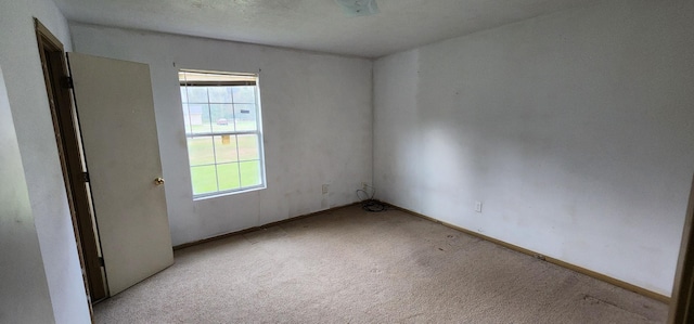 empty room featuring light colored carpet