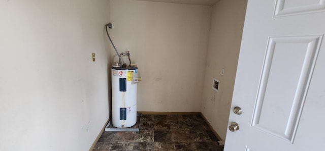 utility room featuring water heater