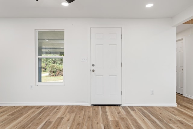 foyer with light wood-type flooring