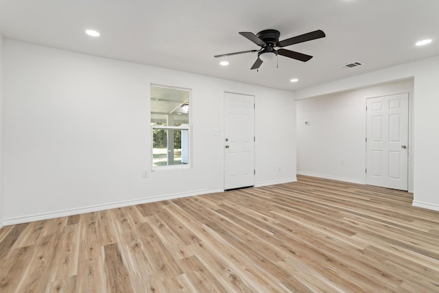 spare room with ceiling fan and light hardwood / wood-style flooring