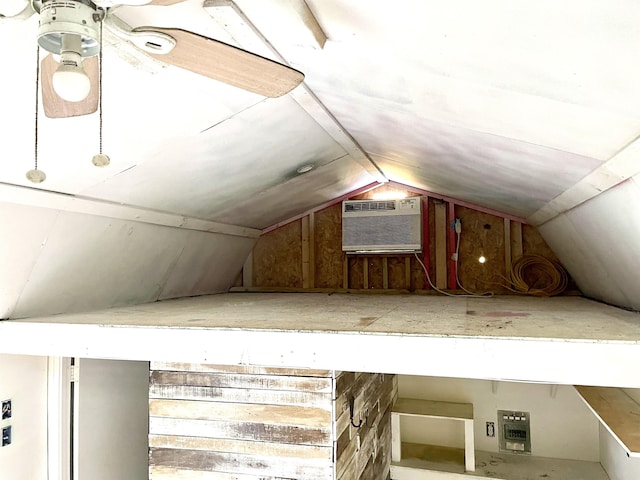 unfinished attic featuring a wall mounted AC