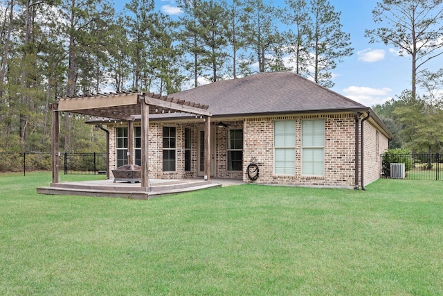 back of property with a pergola, cooling unit, a patio area, and a lawn