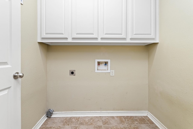 laundry room featuring hookup for an electric dryer, washer hookup, and cabinets