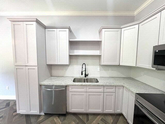 10675 Vinson St, Beaumont, TX 77713 - kitchen featuring a sink, appliances with stainless steel finishes, crown molding, backsplash, and light stone counters