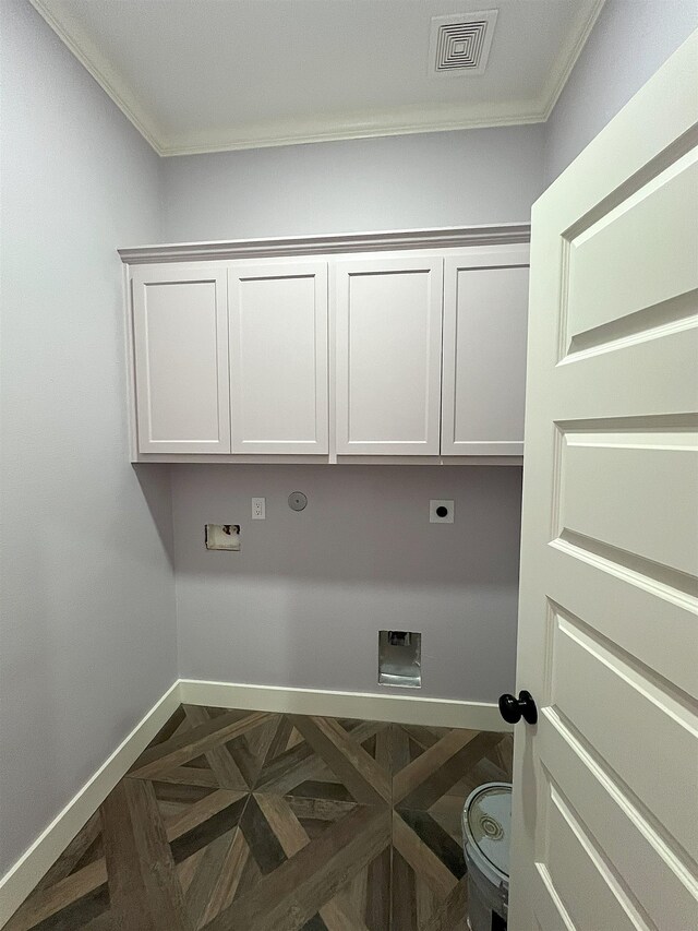 10675 Vinson St, Beaumont, TX 77713 - washroom with electric dryer hookup, crown molding, cabinet space, baseboards, and washer hookup
