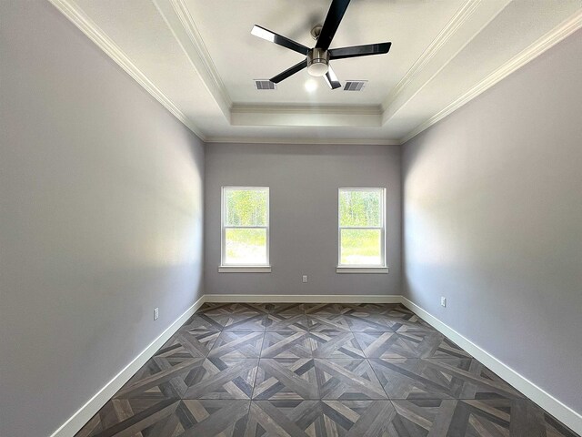 10675 Vinson St, Beaumont, TX 77713 - unfurnished room with a raised ceiling, baseboards, a ceiling fan, and ornamental molding
