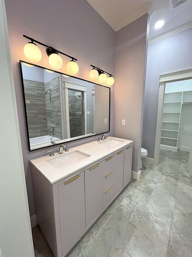 10675 Vinson St, Beaumont, TX 77713 - bathroom with tiled shower, double vanity, toilet, ornamental molding, and baseboards