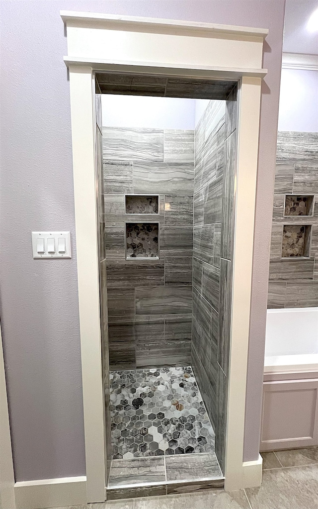10675 Vinson St, Beaumont, TX 77713 - full bathroom with a shower stall, a bathtub, tile patterned flooring, and baseboards