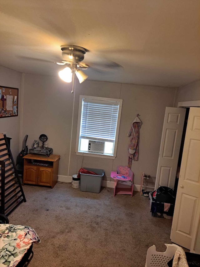 carpeted bedroom with ceiling fan and cooling unit