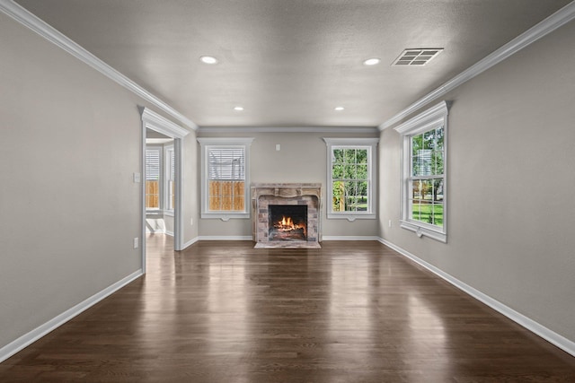 815 Central Dr, Beaumont, TX 77706 - unfurnished living room with ornamental molding, plenty of natural light, dark wood-type flooring, a fireplace, and baseboards