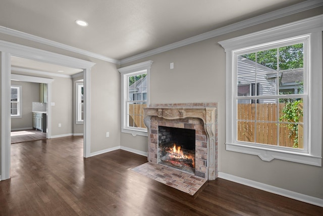 815 Central Dr, Beaumont, TX 77706 - unfurnished living room featuring a fireplace with flush hearth, dark wood-type flooring, baseboards, ornamental molding, and recessed lighting