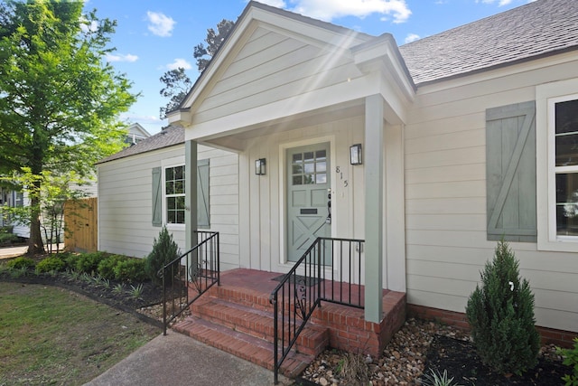 815 Central Dr, Beaumont, TX 77706 - doorway to property featuring roof with shingles