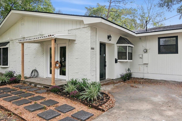 entrance to property with a patio area