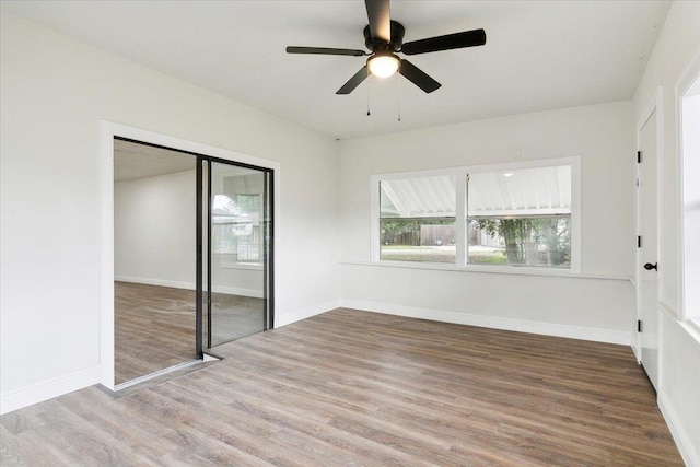 unfurnished bedroom with a closet, ceiling fan, and hardwood / wood-style flooring