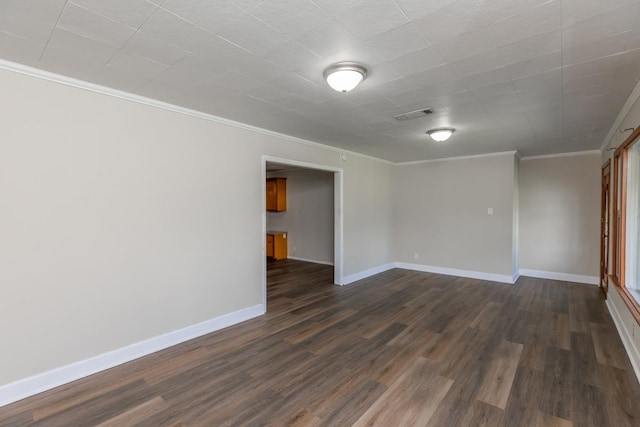 3012 Berry Ave, Groves, TX 77619 - empty room featuring crown molding and dark wood-style flooring