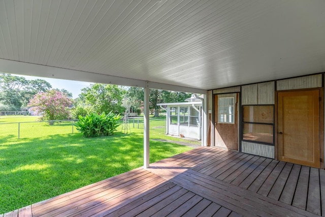 3012 Berry Ave, Groves, TX 77619 - wooden terrace with a fenced backyard and a sunroom