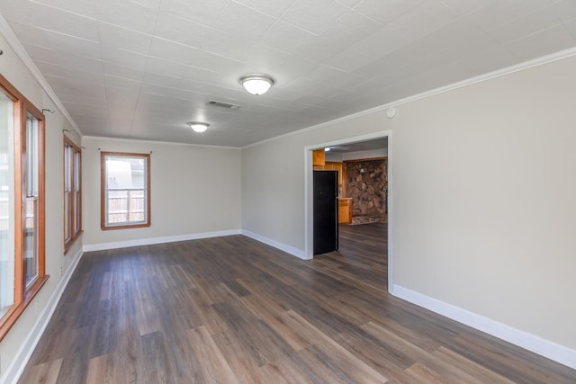 3012 Berry Ave, Groves, TX 77619 - empty room with ornamental molding and dark wood-type flooring