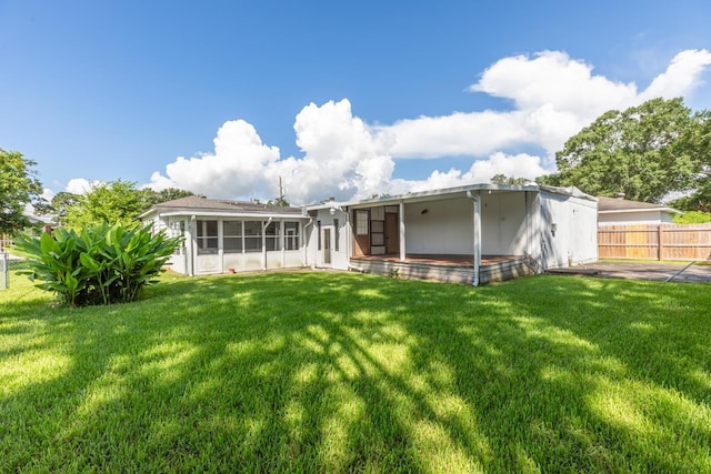 3012 Berry Ave, Groves, TX 77619 - back of house with a sunroom