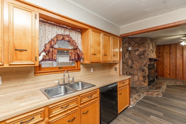 3012 Berry Ave, Groves, TX 77619 - kitchen featuring dishwasher, dark wood-style flooring, light countertops, ornamental molding, and a stone fireplace