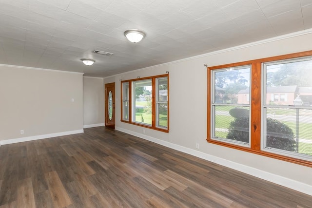 3012 Berry Ave, Groves, TX 77619 - spare room with ornamental molding and dark wood finished floors
