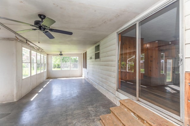 3012 Berry Ave, Groves, TX 77619 - unfurnished sunroom featuring a ceiling fan