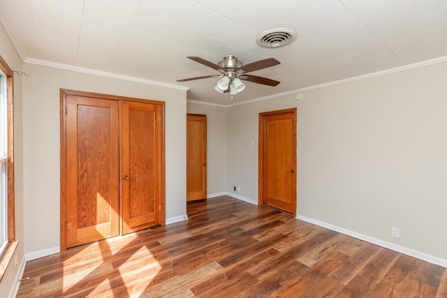 3012 Berry Ave, Groves, TX 77619 - unfurnished bedroom featuring dark wood-type flooring, a closet, ornamental molding, and ceiling fan