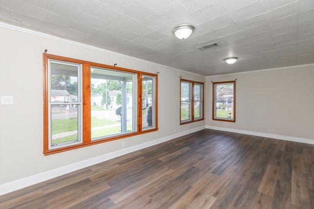 3012 Berry Ave, Groves, TX 77619 - unfurnished room featuring ornamental molding and dark wood-style flooring