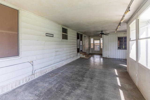 3012 Berry Ave, Groves, TX 77619 - unfurnished sunroom featuring rail lighting