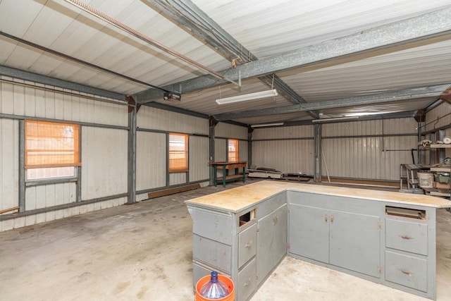 3012 Berry Ave, Groves, TX 77619 - garage with a garage door opener and metal wall