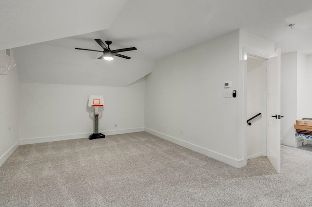 additional living space with ceiling fan, light carpet, and vaulted ceiling