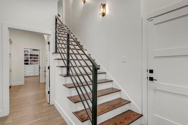 stairs with hardwood / wood-style flooring