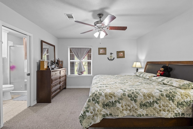 10393 Duncan Rd, Beaumont, TX 77713 - bedroom featuring light colored carpet, a ceiling fan, and ensuite bath